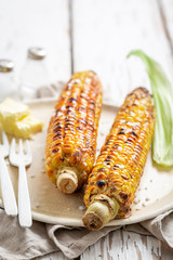 Grilled hot and delicious corncob with salt and butter