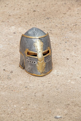 medieval helmet on the floor