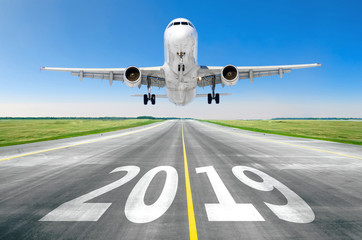 The inscription on the runway 2019 surface of the airport runway texture with take off airplane....