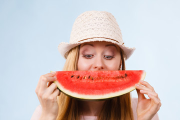 Happy woman holding watermelon