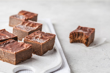 Raw Vegan Chocolate Cake Slices on white background.