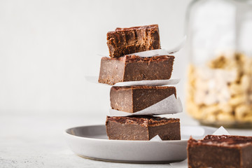 Raw Vegan Chocolate Cake Slices on white background.