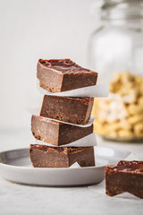 Raw Vegan Chocolate Cake Slices on white background.