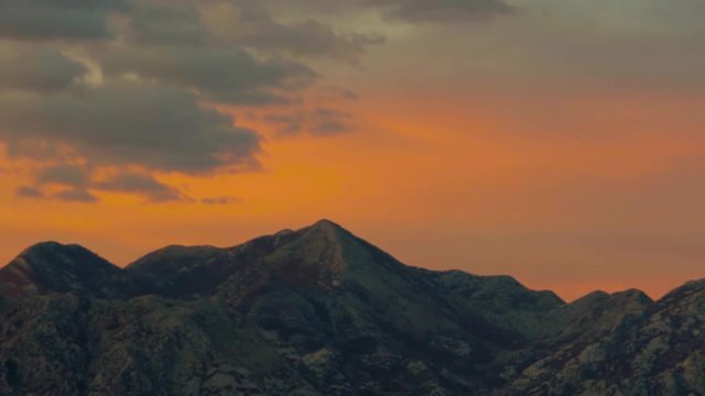 Timelapse - White Cumulus Clouds Swim Over Picturesque Beautiful Mountains In The Autumn Sunset Time