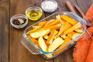 Raw potato and pumpkin slices for baking
