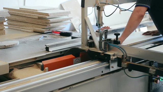 Production of cabinet furniture, sawing, materials on a format-cutting machine