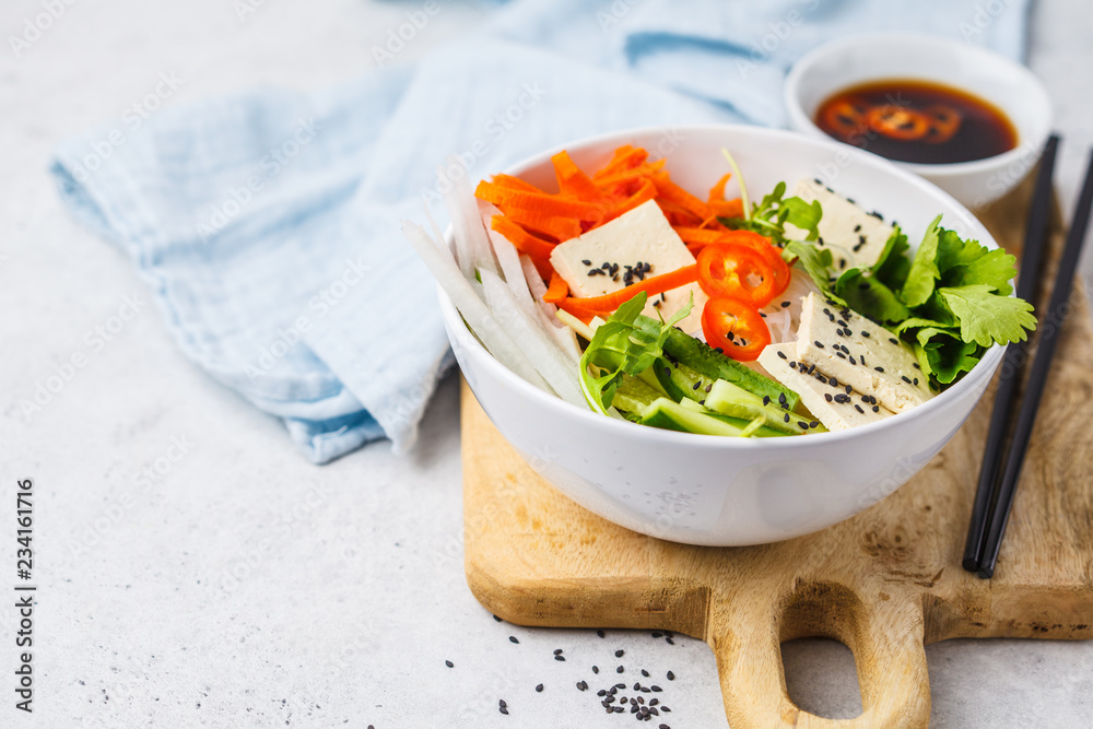 Canvas Prints Vegan bun cha salad bowl. Vietnamese rice noodle with tofu and chilli vegetables salad in white bowl, top view.