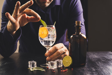 dark background whiskey ice glass ice hand photo moody pouring alcohol bourbon bartender bar hotel home
