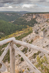 Fototapeta na wymiar Old wood fence at the top of the Rio Lobos canyon, in Soria, Spain
