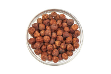 Grey peas in a glass bowl, isolated on a white background. Top view.