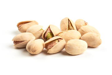 Pistachio nuts, isolated on a white background. Close-up.