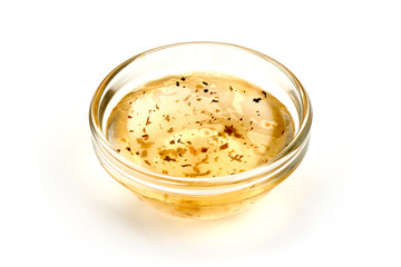 Salad dressing or Homemade sauce, isolated on a white background. Close-up.