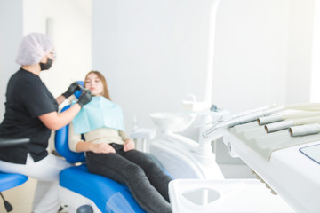 Fototapeta premium Dental clinic. Reception, examination of the patient. Teeth care. Modern dental equipment.