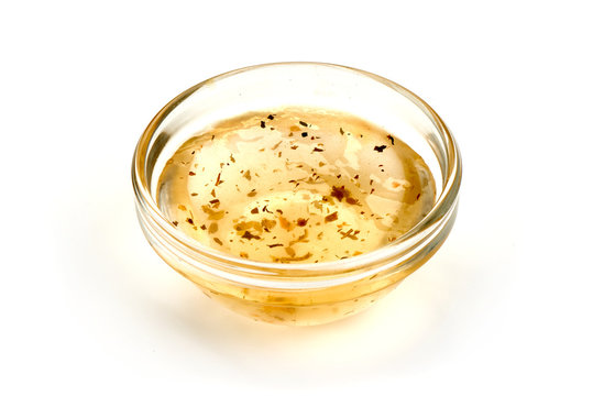 Salad dressing or Homemade sauce, isolated on a white background. Close-up.