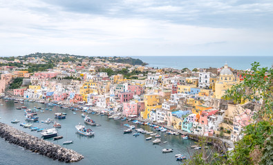 Marina Corricella, colourful fishing village on the island of Procida in the Bay of Naples, Italy. Photo taken from the top of the cliff. 