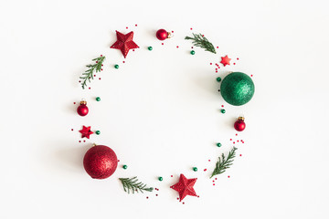 Christmas composition. Christmas wreath made of decorations, fir tree branches on white background. Flat lay, top view, copy space