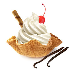 Vanilla frozen yogurt or soft ice cream with maraschino cherry and wafer stick  in wafer bowl isolated on white background with maraschino cherry and vanilla pods