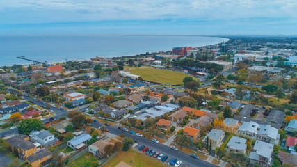 Aerial view of Frankston suburb and pier on Port Phillip Bay coastline in Melbourne, Australia
