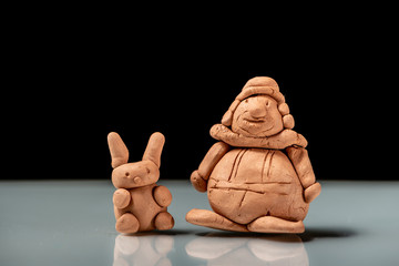 Small figurines made of clay by a child