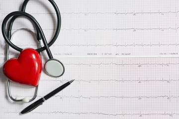 Red heart and stethoscope on electrocardiogram, heart health care concept