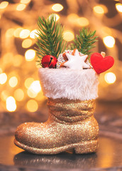 gefüllter Stiefel des Weihnachtsmann in Gold