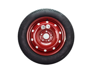 Spare car tire on steel, red rim. Isolated on a white background with a clipping path.