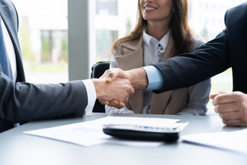 Business people shaking hands, finishing up a meeting. Handshake. Business concept.