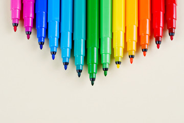A set of felt-tip pens on a table.