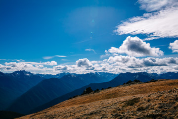 A panoramic view of a remote mountain range on a summer day from a high peak in western Washington state USA