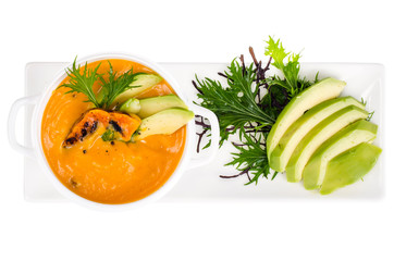 Vegetarian pumpkin soup with avocado