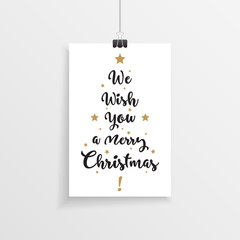 Elegant hanging christmas card with we wish you a merry christmas hand drawn text in a christmas tree layout.