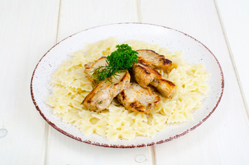 Pasta farfalle with grilled chicken fillet