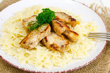 Pasta farfalle with grilled chicken fillet