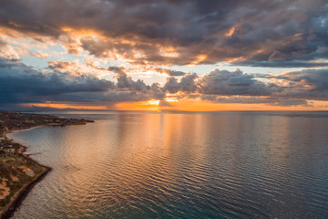Glowing orange sunset over Port Phillip Bay near Mornington Peninsula coastline