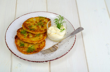 Vegetarian vegetable fried potato pancakes with sauce
