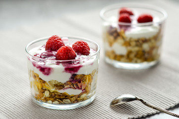 Muesli with yogurt and raspberries. Simple and healthy dessert. Healthy food and low calories.