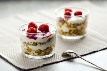 Muesli with yogurt and raspberries. Simple and healthy dessert. Healthy food and low calories.