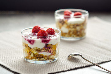 Muesli with yogurt and raspberries. Simple and healthy dessert. Healthy food and low calories.