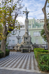 Fototapeta na wymiar Monument to the Marquess of Comillas in the Alameda Apodaca public park in Cadiz, Spain