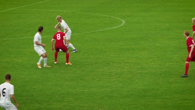 Professional Soccer Players Playing Pass Trying to Score a Goal. Impressive Professional Match on International Championship. Panoramic Slow Motion Shot.