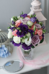 Boutonniere and a bridal bouquet on a  white background.
wedding background
Bouquet of the bride in a glass vase
