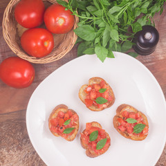 Traditional Italian Bruschetta in a plate. Top view