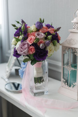 Boutonniere and a bridal bouquet on a  white background.
wedding background
Bouquet of the bride in a glass vase
