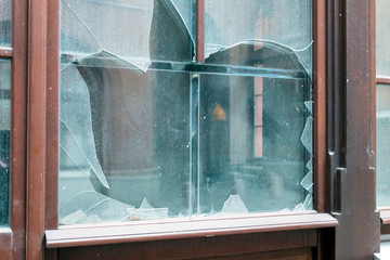 Dirty broken glass in a building door