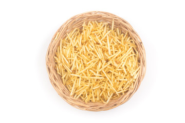 Potato Sticks in a basket bowl. Batata Palha. Top view