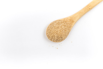 Pile of demerara sugar in a spoon. Top view
