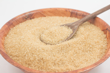 Demerara sugar in a wooden  bowl