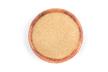 Demerara sugar in a wooden  bowl. Top view