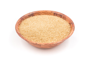 Demerara sugar in a wooden  bowl