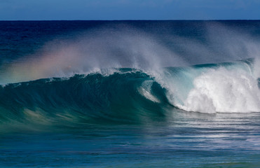 Fototapeta na wymiar Breaking Ocean wave with rainbow colors